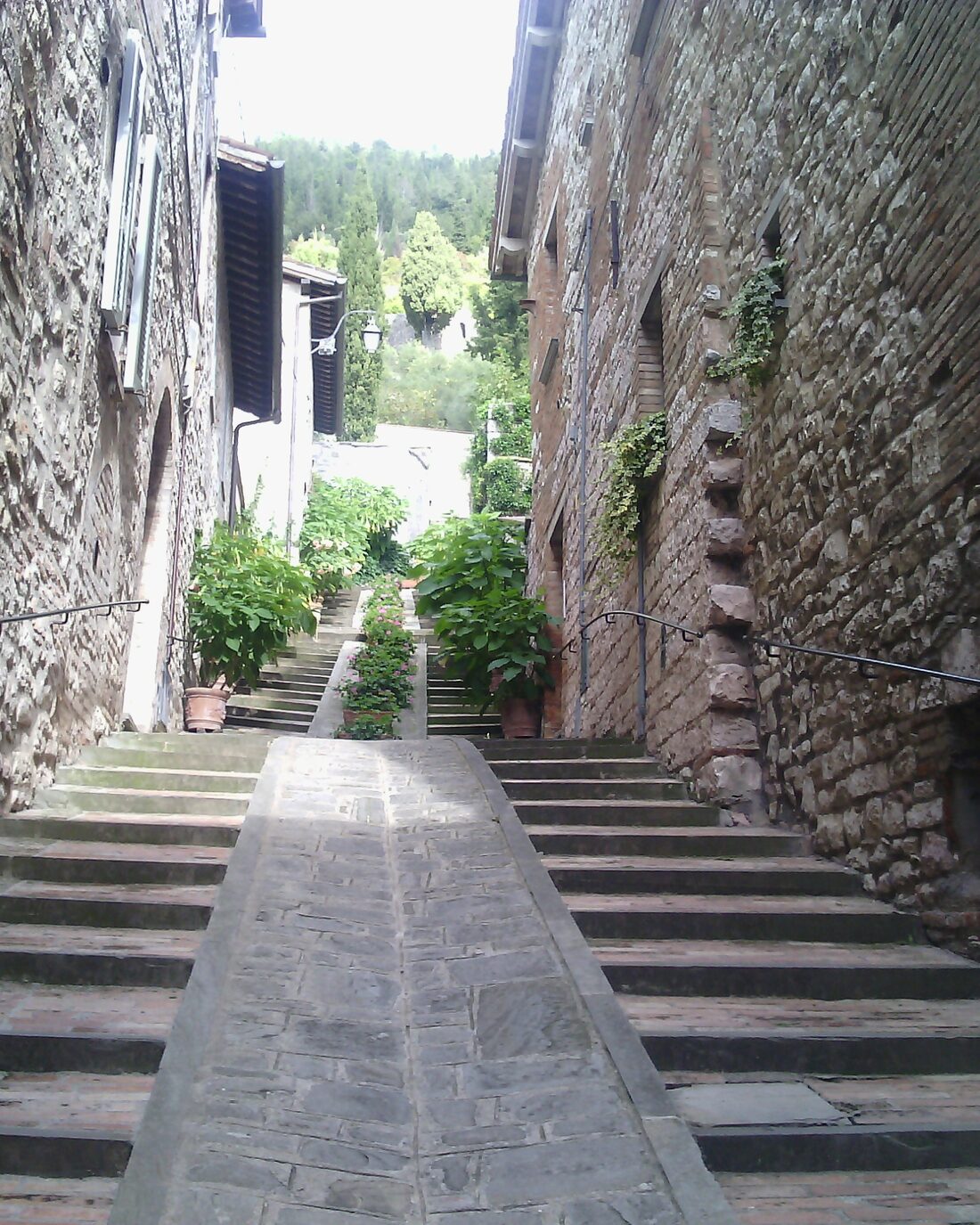 A stepped lane between stone houses in an Umbrian village